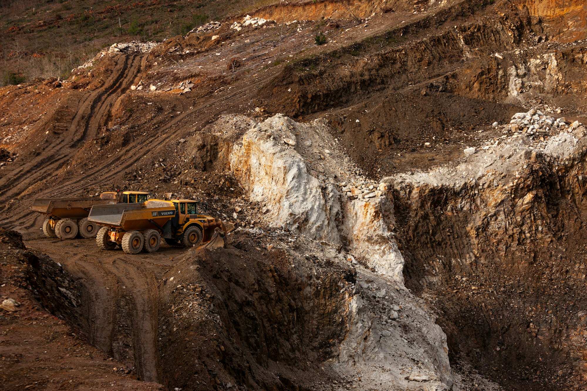 A large truck on a dirt mine road